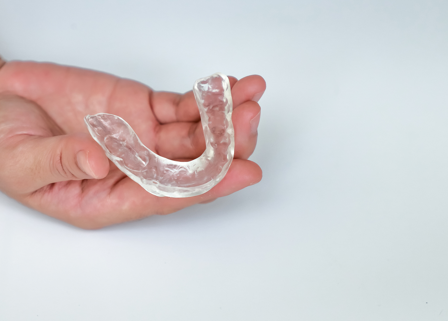 what an occlusal guard is and how it protects teeth from grinding and clenching